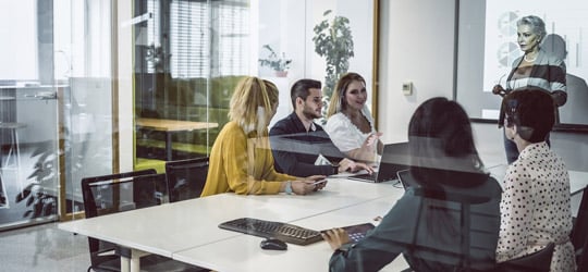 diverse business people seated around a conference table